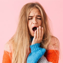 Young woman yawning 