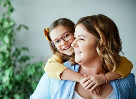 Smiling mother and young daughter 