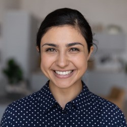 Closeup of woman with straight teeth smiling