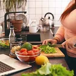 Woman preparing healthy meal at home