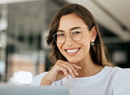 Close-up of smiling woman with glasses